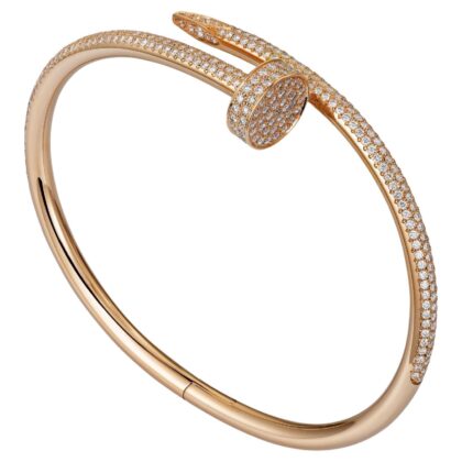 Gold-tone nail-inspired bracelet featuring rows of sparkling pavé stones and a sleek curved design.